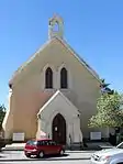 Church, end gable with raking cornice & belfry faces street, twin lancet windows over entrance porch.
Nave 4 bays, buttresses.
Lancet windows, pointed hoods, with coloured diamond panes, original wooden tracery (?).
Rough-cast walls, stone plinth. This Mission Church, the foundation stone of which was laid on 4 May 1871, was completed in December 1872 by the building contractor Adriaan Ventura.
The Rev. Paulus Teshe was the main driving force behind its erection.

Architectural style: Cape Neo-Gothic.
Type of site: Church
Previous use: Church.
Current use: Museum.