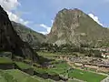 The mountain Pinkuylluna (on the right) above the town Ollantaytambo. A huge face of stone is visible beside the Pinkuylluna ruins.