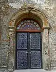 details on the side of a door of the church