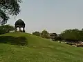 One of Metcalfe's "follies", a chhatri, with Jamali Kamali Mosque in the background, Mehrauli.