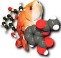 A computer graphics image. On the left is a ball and stick molecule model. In the middle is an orange fish, tail down, face up. On the right is a space-filling molecule model.