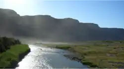 The Orange River from the border bridge between Noordoewer and Vioolsdrif. Extreme heat and sunlight cause visible evaporation.