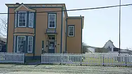 The O'Reilly House with St. Luke's Cultural Heritage Centre in the background.