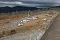 Emergency shoring of the emergency spillway with rock and concrete (February 16)