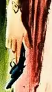 Detail of a woman's hand holding a revolver