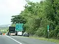 PR-22 east approaching exits 75A-B to PR-10 in Arecibo