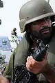 A Navy's VBSS Team member of the SSG(N) stands in security aboard PNS Khaibar during the VBSS drill with British Special Boat Service in 2009.