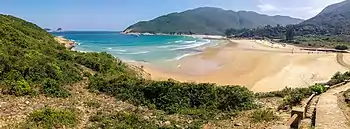 Beach with mountains in background