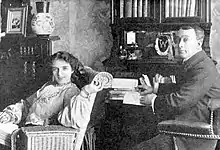 middle-aged white couple in an Edwardian interior setting