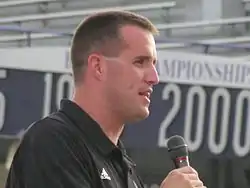 Pat Fitzgerald in a black shirt.