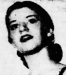 A young white woman with large dark eyes.