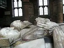 Tomb of Sir Edward Littleton (died 1558) and his wives, Helen Swynnerton and Isabel Wood. Attributed to the Royley workshop in Burton on Trent. Formerly close to the table tomb of Sir Edward's parents, this is now in the chancel.