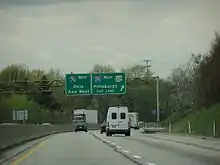 Cars and trucks on four-lane, divided highway