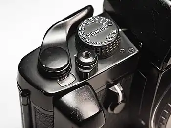 shutter button lock switch on the early model Pentax LX, shaped like a pointer knob