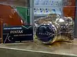 Plastic-wrapped Pentax LX Gold on display