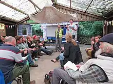 Group at permaculture convergence listen to Andy Goldring