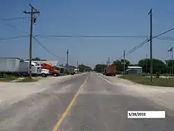 In front of Mark Street on FM 2210, looking east