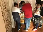 Salvadorans using an Athena Bitcoin ATM