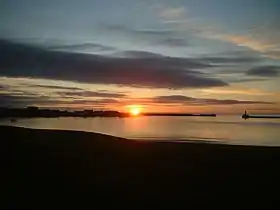 Peterhead Bay. 0630, calm summer's morning. (L-R) 'downtown – harbour – north breakwater – south breakwater. foreground – above the Lido.