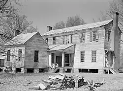 Rear view of the detached kitchen and former plantation home of the Mark Pettway family, called Sandyridge, in Boykin April 1937. The house was demolished a short time later.  Photographed by Arthur Rothstein.