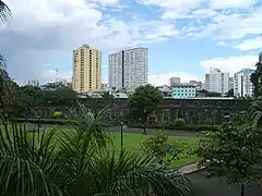 The grounds of Fort Santiago with the Binondo skyline in the background