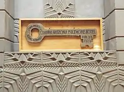 The Wooden key on display above the fireplace in the History Room.