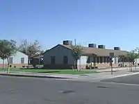 The Marcos de Niza Housing Project was established by Father Emmett McLoughlin in 1941. The housing project is located at 305 W. Pima St. This property is recognized as historic by the Hispanic American Historic Property Survey of the City of Phoenix.