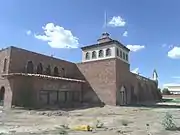 The historic "El Cid Castle" was a bowling alley that resembled a Moorish Castle. It was built by the late Dr. Kenneth Hall, a physician who served the Community of Sunnyslope in Phoenix. Construction on the structure began in 1963 and was completed in 1980. It is located at the Northwest corner of 19th Ave and West Cholla Drive, which technically is on the opposite side Sunnyslope's western boundary.