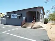 The Charles and Eleanor Abel House was built in 1955 and is located at 11430 Cave Creek Roa. It was the first house in Sunnyslope with a bomb shelter, which also served as a basement. The residence is now used for commercial purposes.