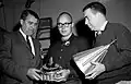 The Pioneer 4 probe is inspected by (left to right) Dr. Wernher von Braun, payload engineer John Casani and Dr. James Van Allen.