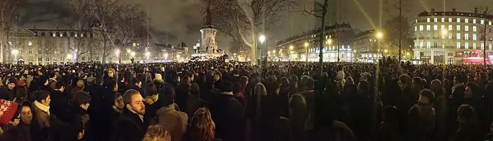 Demonstrators gather at the Place de la République in Paris on the night of the attack