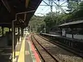 A view of the platforms and tracks looking in the direction of Kurōbaru.