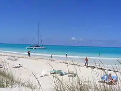 Playa Pilar with the catamaran Ocean Voyager moored off the beach