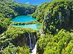 Turqois colored lakes among white rocks.