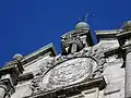 Spanish coat of arms at the top of the façade