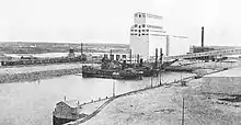 harbour with ships and grain elevator