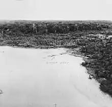 An aerial photograph showing a cleared area of beach, with the words "Porton jetty" labelled in pencil with an arrow.