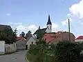 Old part of Stodůlky with church of St. James the Great. History of the church dates at least to 13th century but the current Gothic revival edifice is much more recent (1902-3)