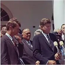 Attorney General Robert F. Kennedy and President John F. Kennedy are pictured speaking at the White House