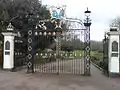 Gates to Priory Park, Prittlewell, Southend-on-Sea. The plaques on the gateposts commemorate the presentation of the park to the people of Southend, as a gift from local jeweller and benefactor R A Jones.