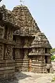 Vimana (tower and shrine) outer wall with protruding over wall aedicula (minor shrine) of Someshvara temple, Haranhalli