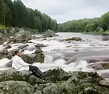 Sergey Prokudin-Gorsky in 1915 at the Kivach waterfall