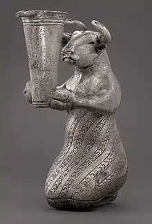 Kneeling Bull with Vessel. Kneeling bull holding a spouted vessel, Proto-Elamite period (3100–2900 BC). Metropolitan Museum of Art