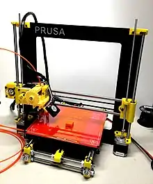 Completed Prusa i3, printed parts in yellow.