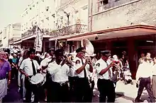 Second line on Decatur Street, French Quarter, for deceased musician Albert "Pud" Brown.