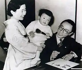 Pujie and Hiro Saga with their child