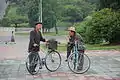 Two men with bicycles, Pyongyang, 2016