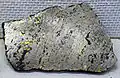 Pentlandite occurring with pyrrhotite, chalcopyrite, and magnetite. Specimen from Sudbury, Ontario, Canada