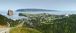 Percé with Percé Rock and Bonaventure Island in the background