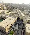 View of the qasaba (centre) from above, from one of the minarets of Bab Zuweila. (The building on the bottom left is the Mosque of Salih Tala'i.)